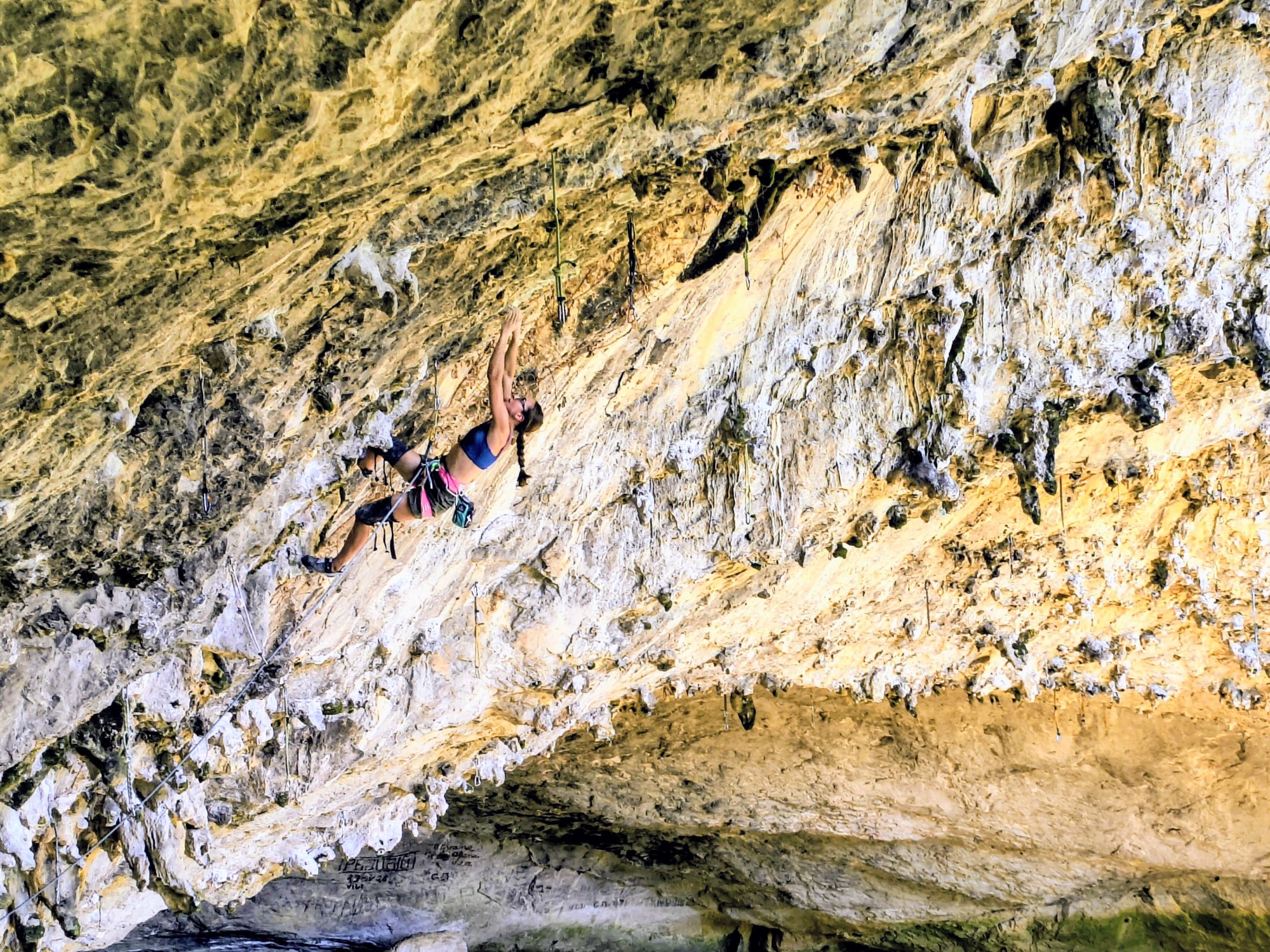 Basia Debowska in Helihopter v omaki (8b) in the big cave of Osp@photo by Lukasz Debowski